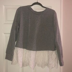 Grey sweatshirt with eyelet hem